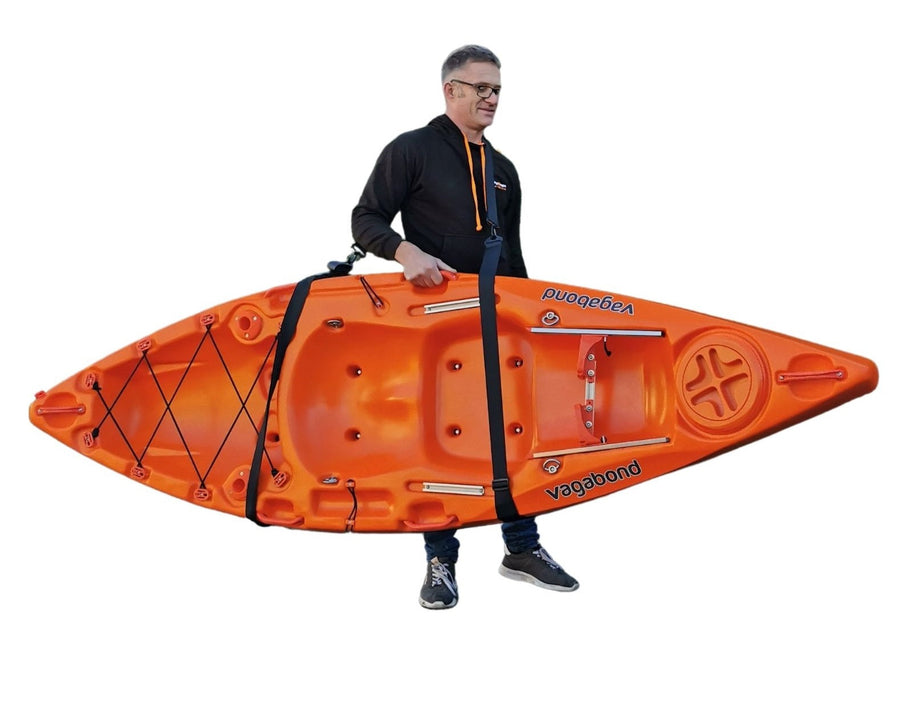 adult carrying a kayak using an adjustable carry strap manufactured by cambridge kayaks