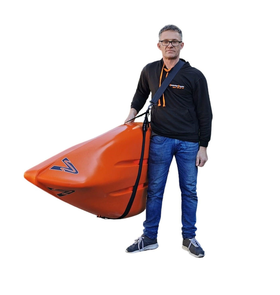 adult carrying a kayak using an adjustable carry strap manufactured by cambridge kayaks