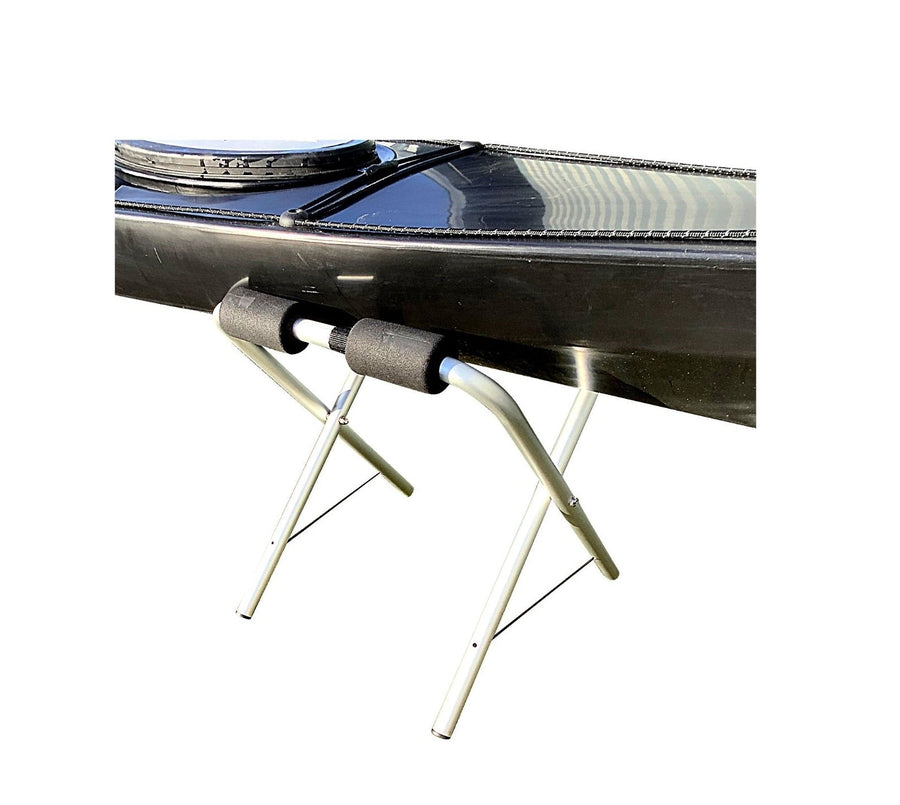 pair of kayak stands with large kayak sitting on top manufactured by cambridge kayaks